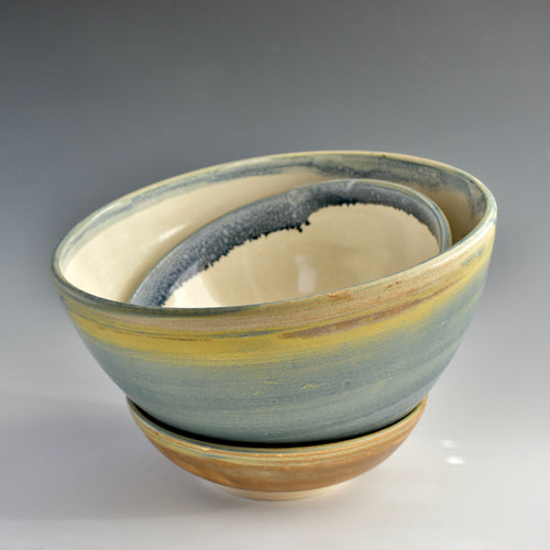 Porcelain bowls with Denim glaze on a gradient background